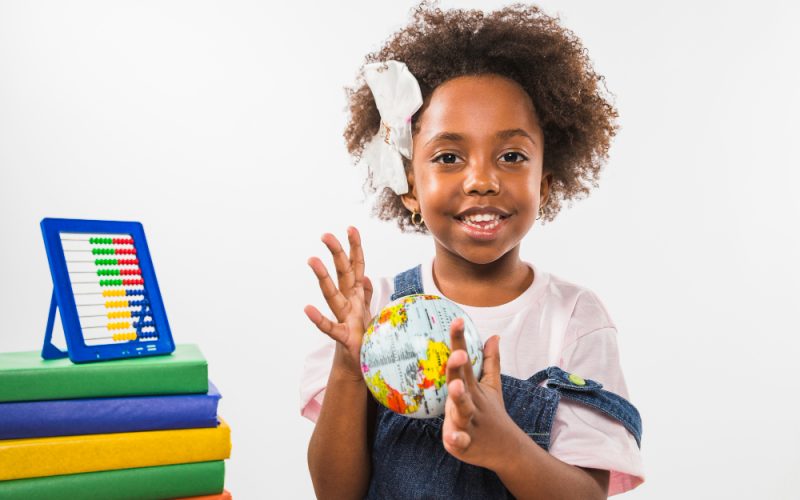 child-playing-with-globe-studio